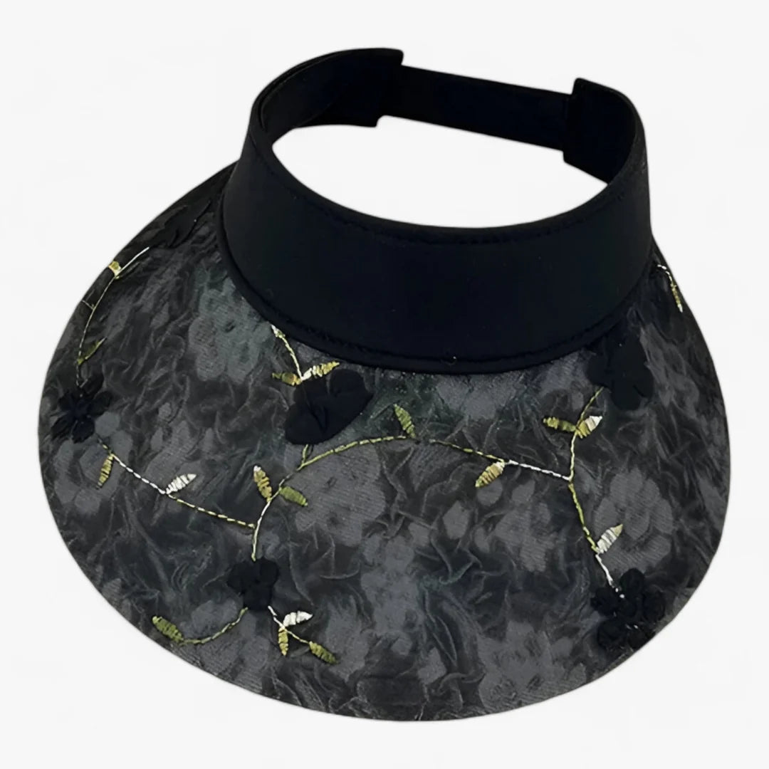 Foldable straw hat with floral accent and UV protection