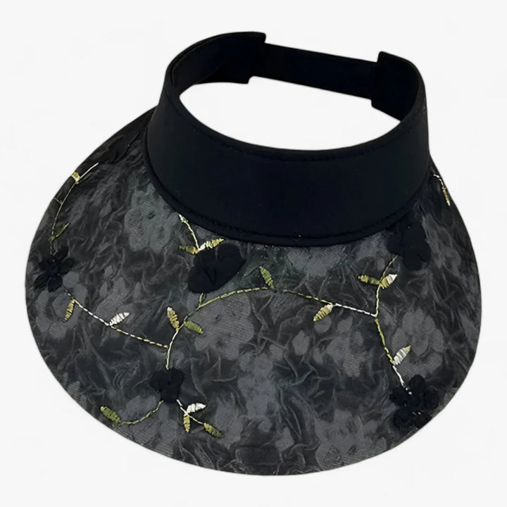 Foldable straw hat with floral accent and UV protection